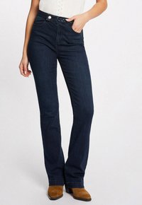 Клешеные брюки