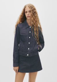 Юбка с накладными карманами