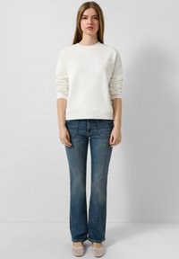 Клешеные брюки