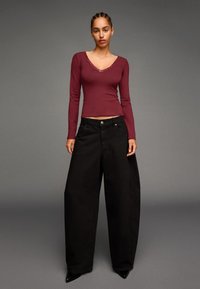 Юбка с накладными карманами