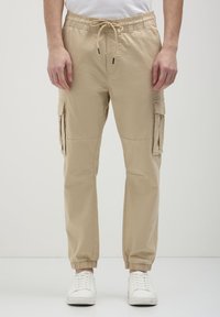 Брюки с накладными карманами Брюки с накладными карманами