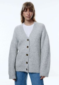 Длинный жилет