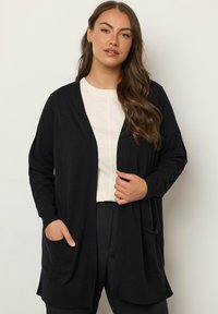 Длинный кардиган