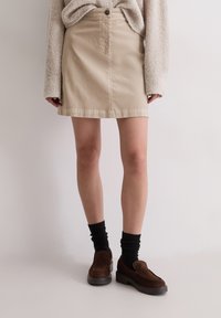 Юбка с накладными карманами Юбка с накладными карманами