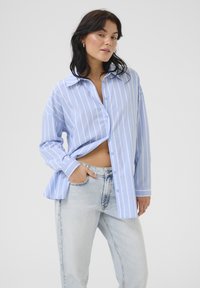 Длинная блузка