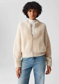 Пуховой жилет