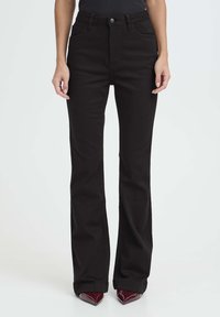 Клешеные брюки