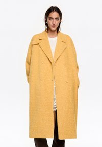 Шерстяное пальто