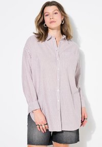 Длинная блузка