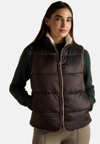 Пуховой жилет