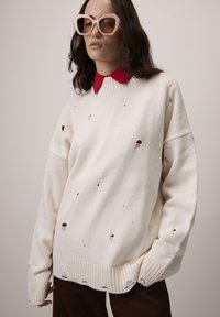 Длинный пуловер