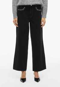 Клешеные джинсы