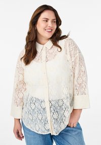 Длинная блузка