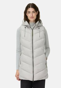 Длинный жилет