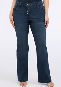 Клешеные джинсы