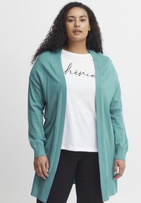 Длинный жилет