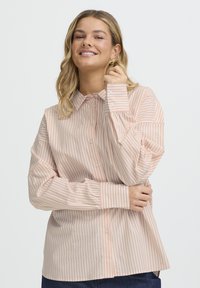 Длинная блузка