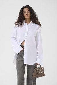 Длинная блузка