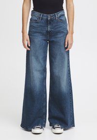 Клешеные джинсы Клешеные джинсы