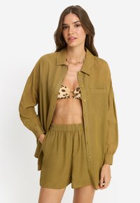 Длинная блузка