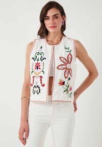 Джинсовая жилетка