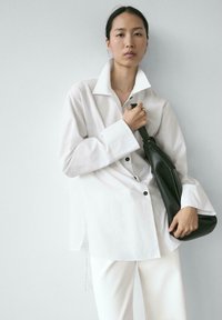 Длинная блузка