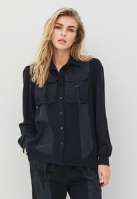 Длинная блузка