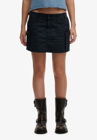 Юбка с накладными карманами