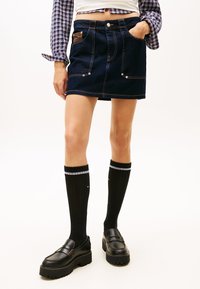 Юбка с накладными карманами