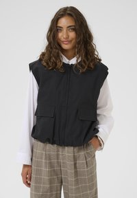 Джинсовая жилетка