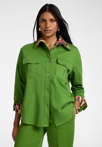 Длинная блузка