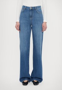 Джинсы бойфренда