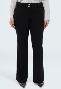 Клешеные джинсы