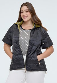 Пуховой жилет Пуховой жилет