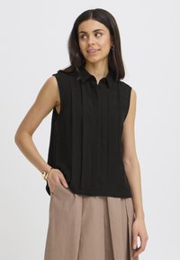 Блузка без рукавов