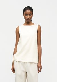 Блузка без рукавов