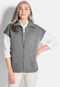 Длинный жилет