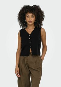 Вязаный жилет Вязаный жилет