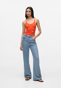 Клешеные джинсы Клешеные джинсы