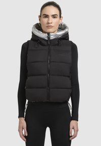 Стеганый жилет Стеганый жилет