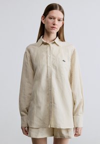 Длинная блузка