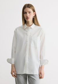 Длинная блузка