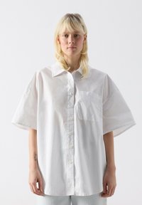 Длинная блузка