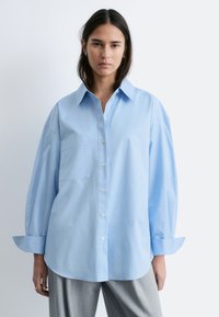 Длинная блузка