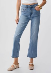 Клешеные брюки