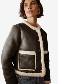 Пуховой жилет Пуховой жилет