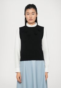 Пуловер без рукавов Пуловер без рукавов