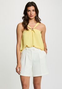 Блузка без рукавов