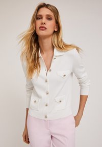 Вязаный жилет Вязаный жилет