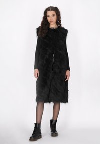 Пуховой жилет